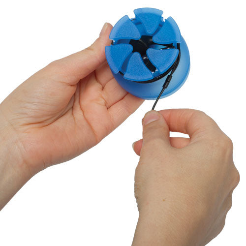 Photo of a pair of hands demonstrating how to wrap a pair of earbuds around a blue Nest.