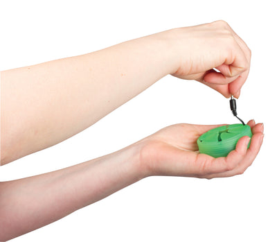 Photo of a pair of hands demonstrating how to pull a pair of black earbuds from a green nest.