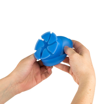 Photo of two hands demonstrating how to open a blue NestXL.