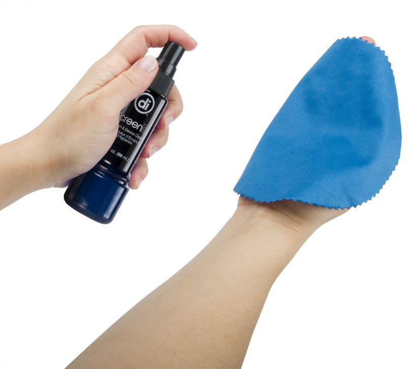Studio photo of a pair of hands holding a bottle of ScreenDr and spraying it on a blue microfiber cloth.